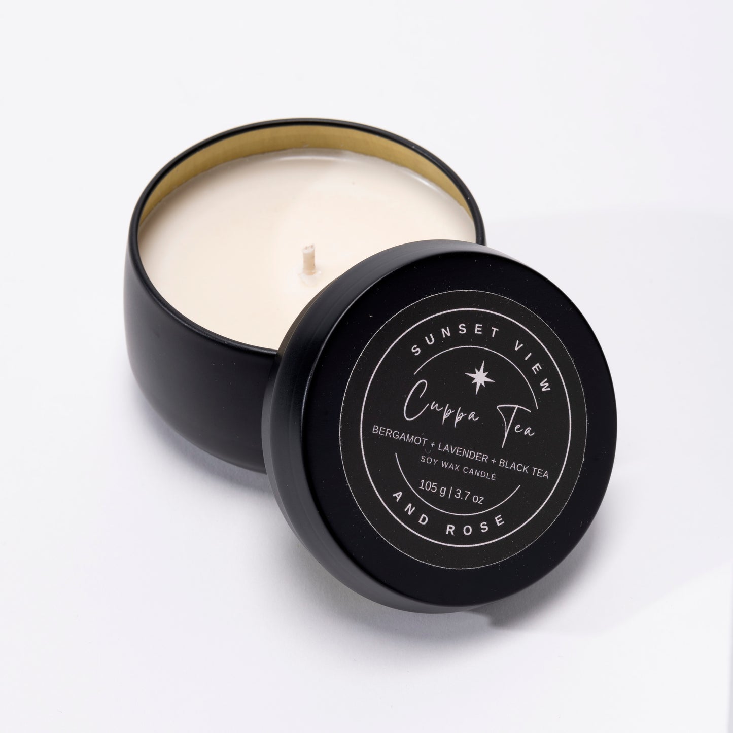Sunset View and Rose offers a handsome matte black 3.7oz travel tin scented soy wax candle, scented with Bergamot, Lavender, and Black Tea. Our long lasting candles are made with premium nontoxic fragrance oils. Our sustainable candles and home fragrances are handmade with love in Pittsburgh, Pennsylvania.