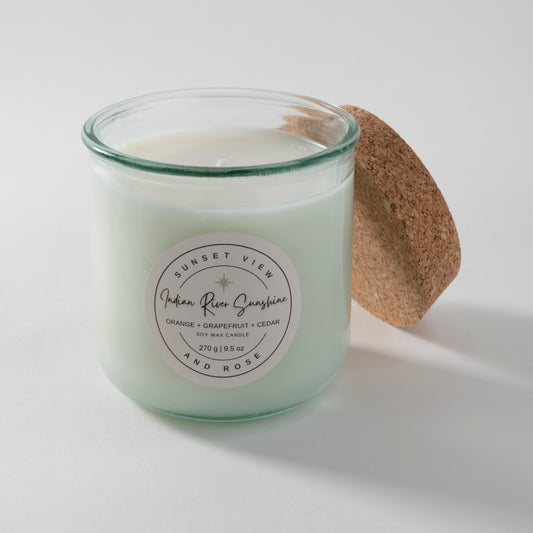 Sunset View and Rose uses a 9.5 ounce scented soy wax candle in a recycled Spanish glass jar, scented with Orange, Grapefruit, and Cedar. Our sustainable candles are made with premium fragrance oils. We craft delightful nostalgic nontoxic candles and home fragrances with environmentally friendly business practices in mind.
