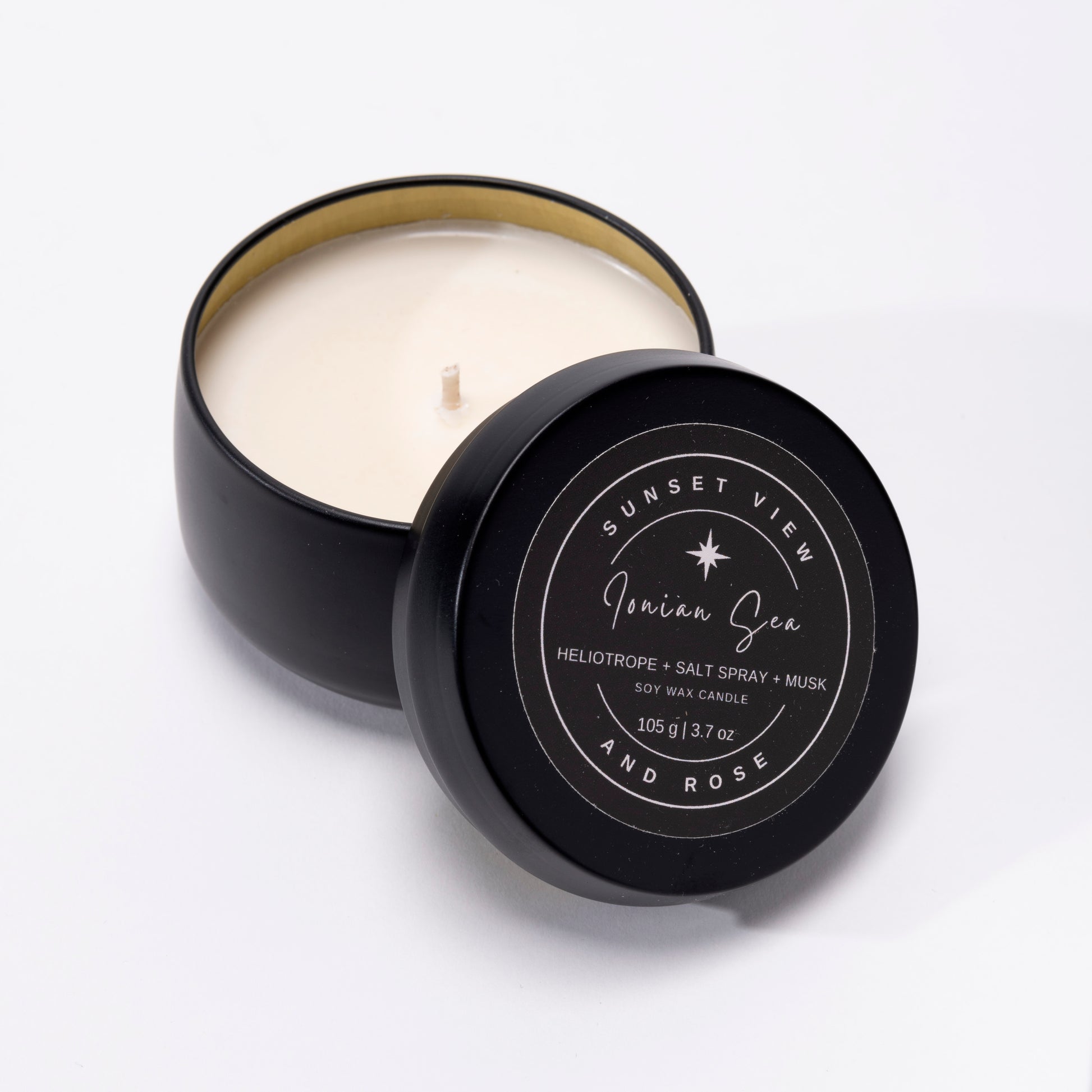 Sunset View and Rose offers a handsome matte black 3.7oz travel tin scented soy wax candle, scented with Heliotrope, Salt Spray, and Musk.  Our long lasting candles are made with premium nontoxic fragrance oils.  Our sustainable candles and home fragrances are handmade with love in Pittsburgh, Pennsylvania.