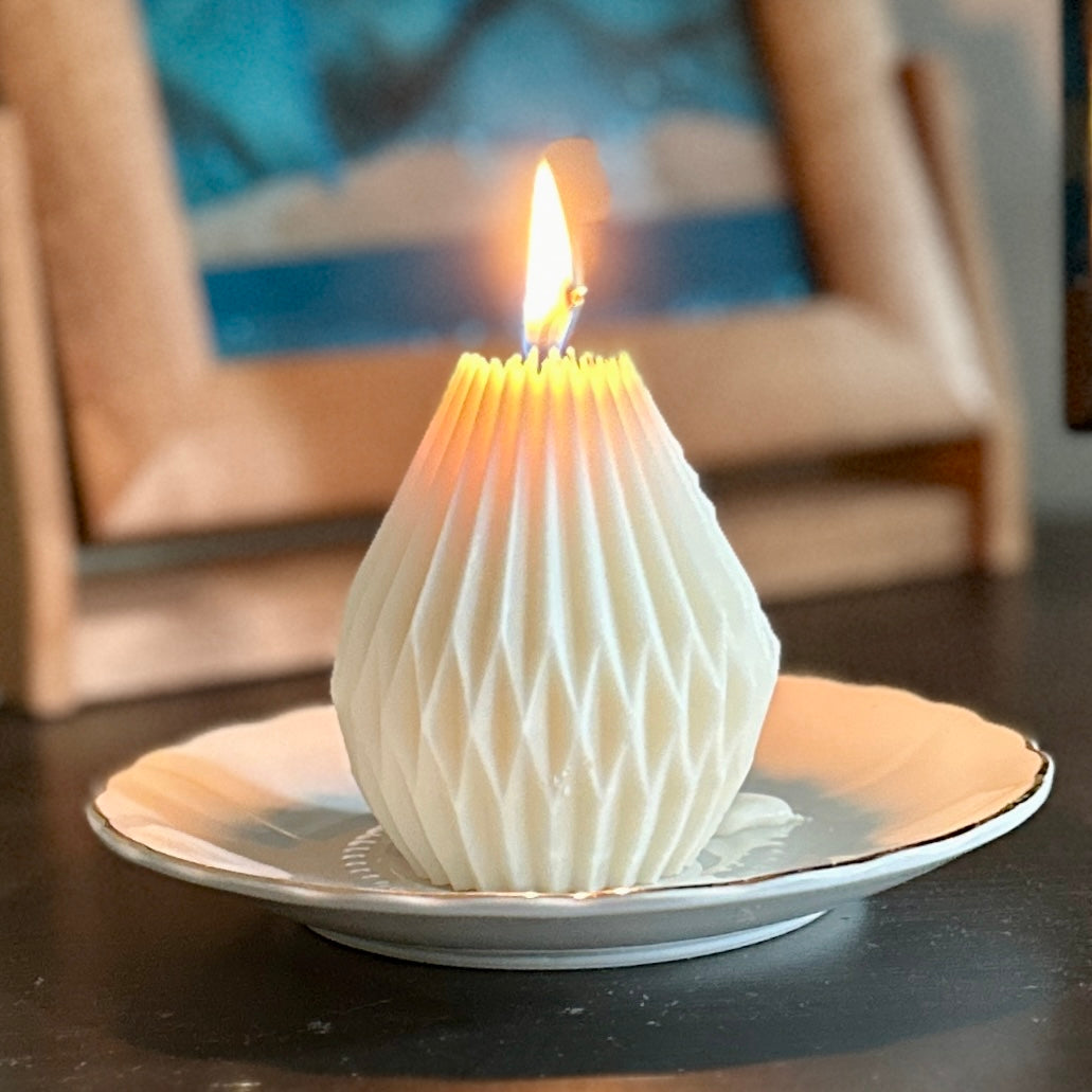 What does a soy wax pillar candle look like when burning? The wax might drip and pool artfully on the candle plate. 