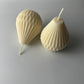 Dimensional pear shaped pillar candles measure about 2.7incheswide at the base and about 3.3 inches tall.  Please use a candle plate to burn pillar candles. 