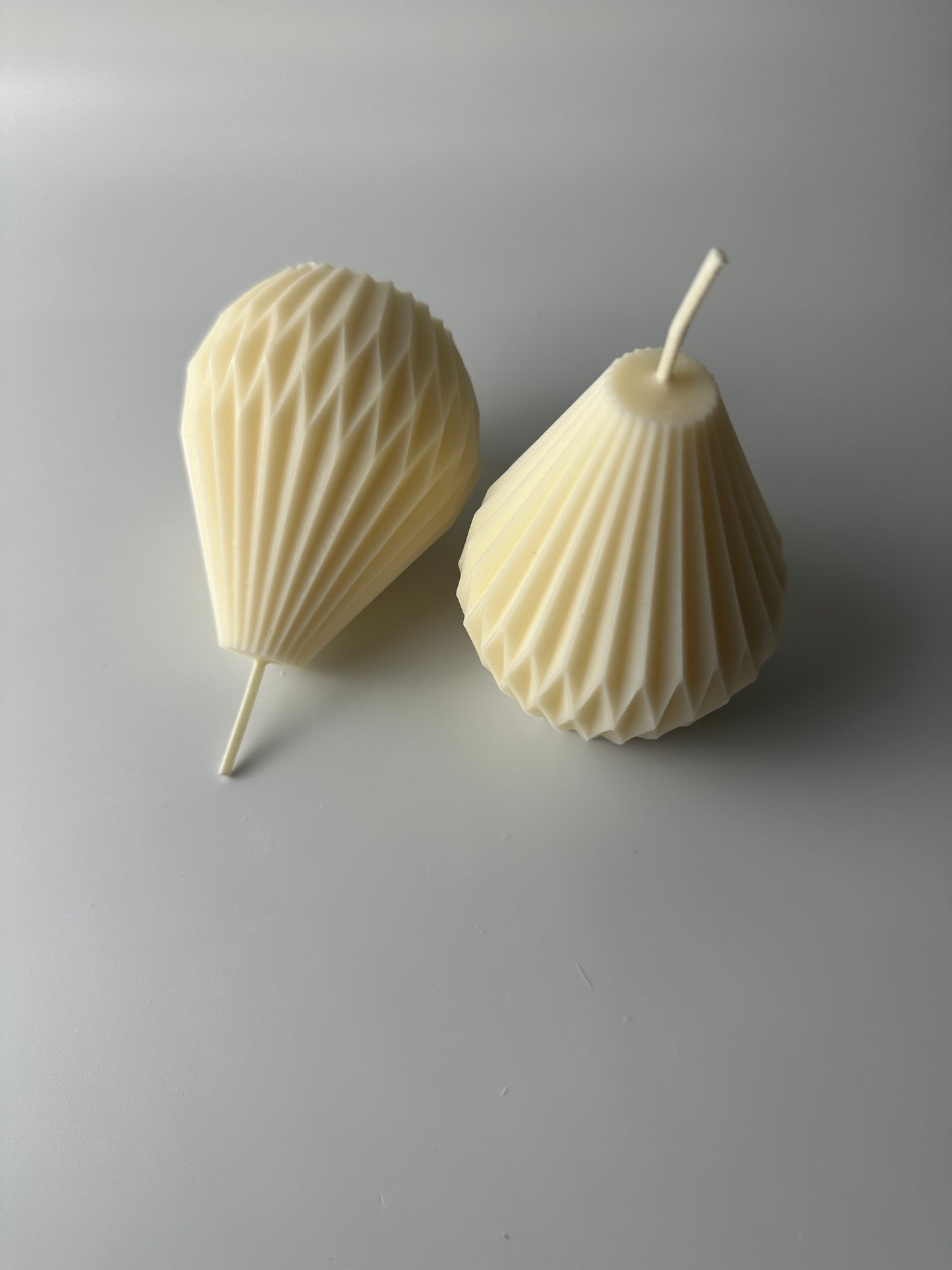 Dimensional pear shaped pillar candles measure about 2.7incheswide at the base and about 3.3 inches tall.  Please use a candle plate to burn pillar candles. 