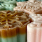 Advent Calendar Wax Melts measure 1.8in x 1.8in x 0.5in and each weigh 0.75 ounce.  They are generously sized and provide long lasting scent all day long.